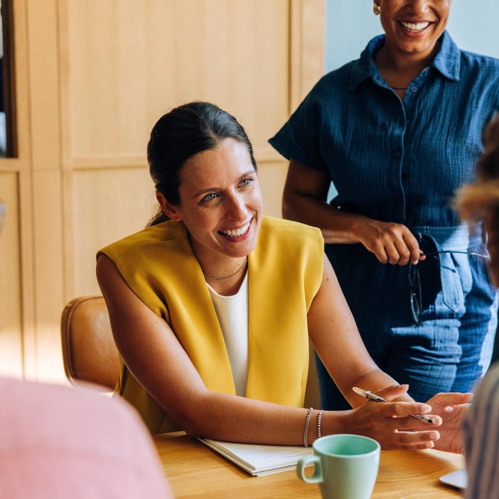 A,Professional,Woman,Leads,A,Friendly,Discussion,With,Colleagues,During