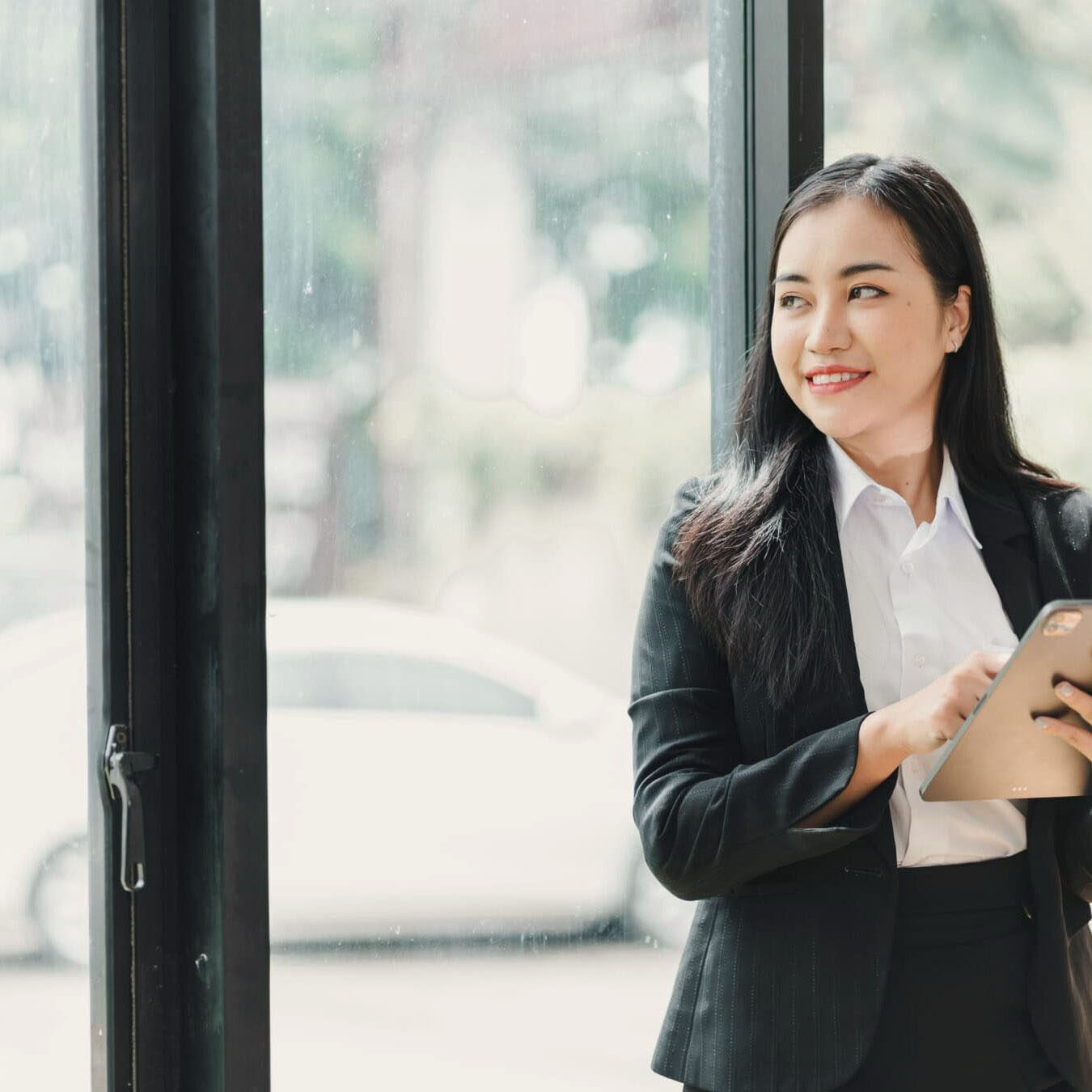 Woman reviews iPad to look at the next steps after taking her ACC Exam