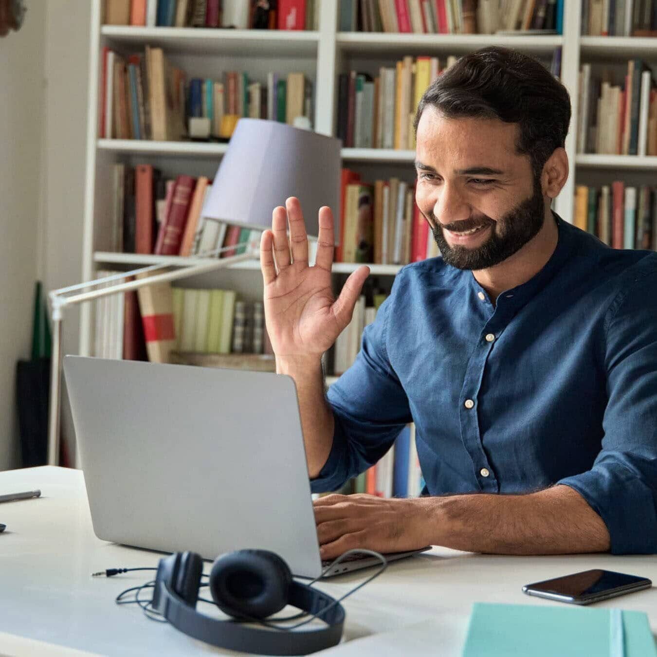 A man calls the ICF Ethics Assist line from his at home office.