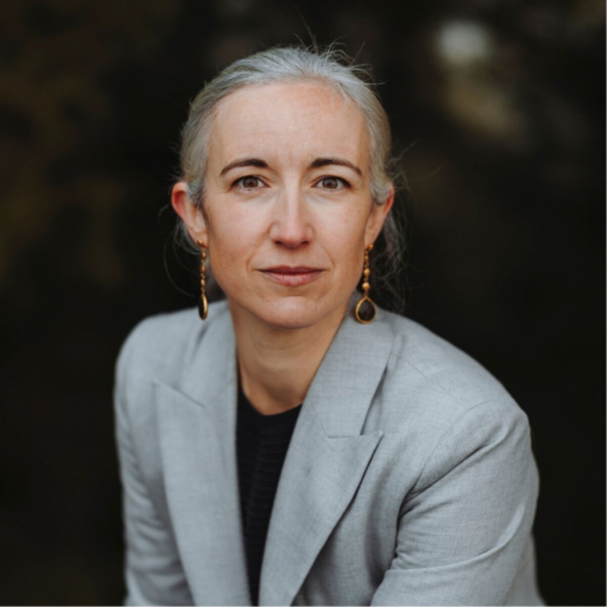 Headshot of Lise Bruynooghe, MCC with the International Coaching Federation. Known for coaching global leaders and teams in the Swiss mountains.